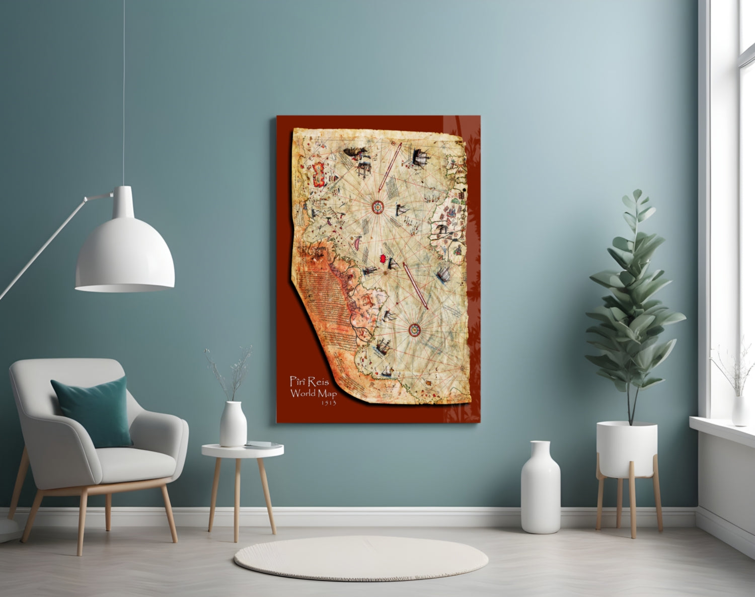 Piri Reis World Map 1513 glass wall art with red frame displayed in modern teal room with white chair and potted plant.