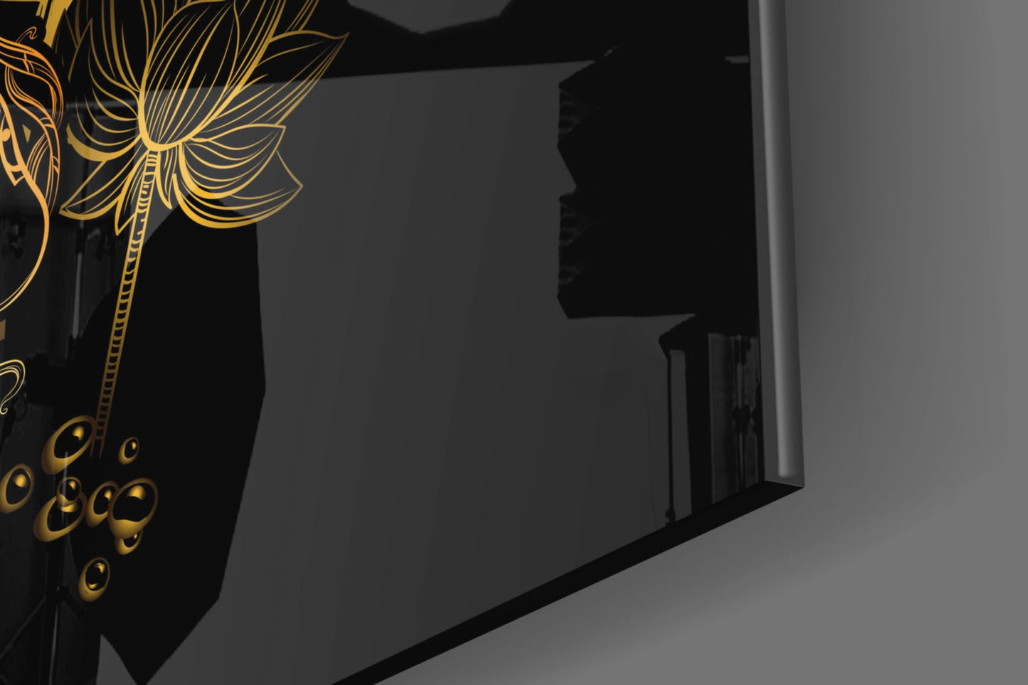 Black glass wall art with gold yin-yang design and decorative floral elements displayed in modern interior space.