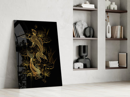 Black glass panel with gold yin-yang koi fish design leaning against white wall beside built-in shelving.