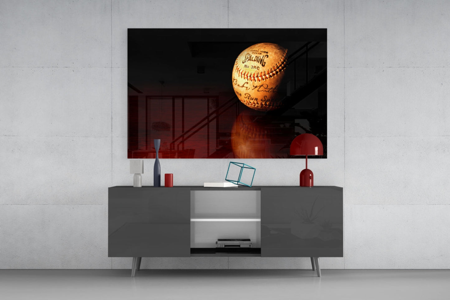 Spalding baseball glass wall art mounted above gray media console, displaying illuminated vintage ball with red stitching and text.
