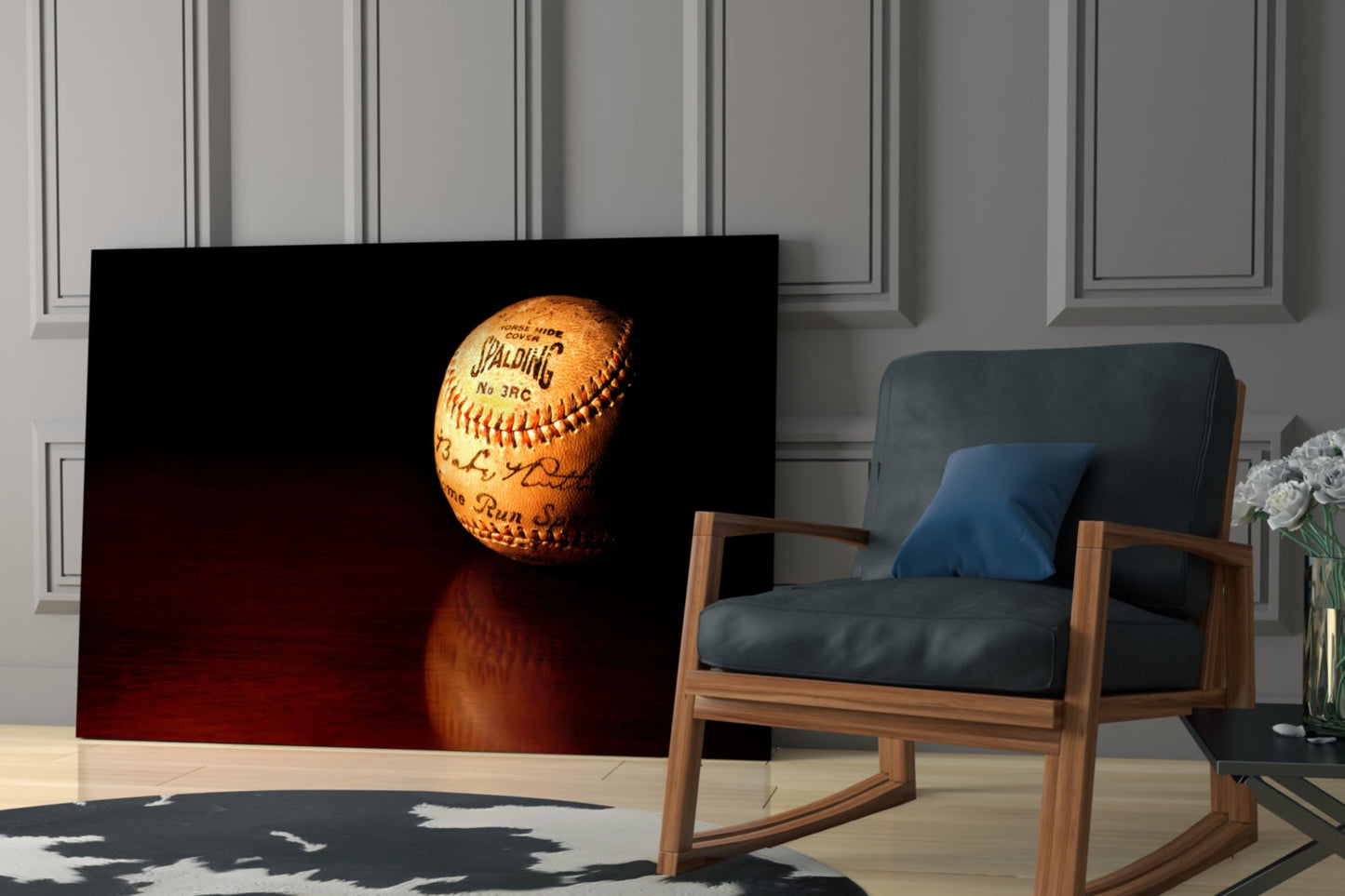 Vintage Spalding baseball with red stitching displayed on black glass panel in modern living room setting.