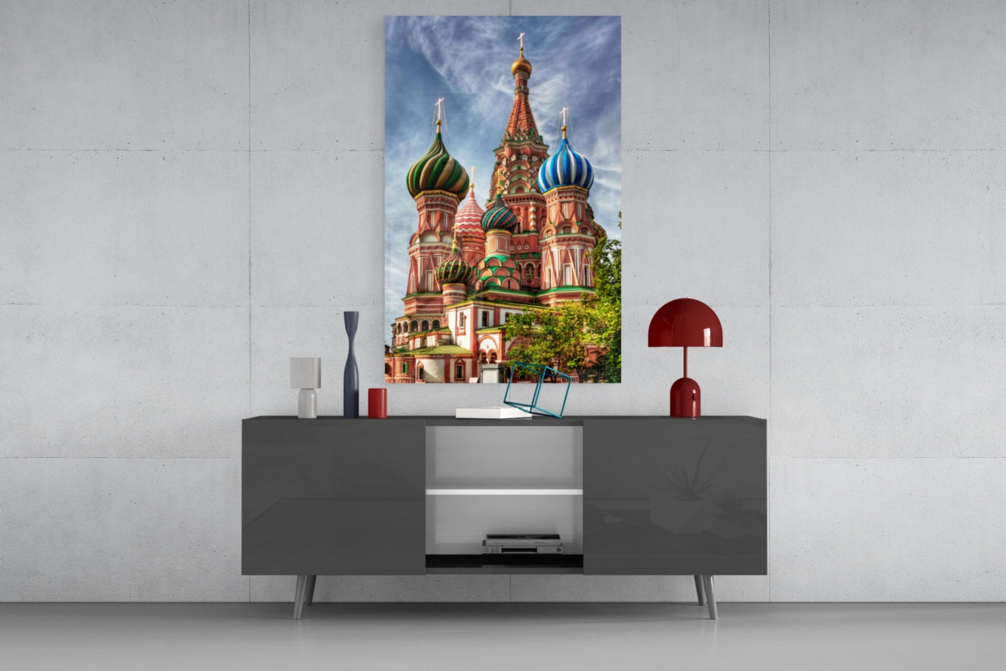Saint Basil's Cathedral glass wall art displayed above a gray media console with decorative accessories in a modern interior setting.