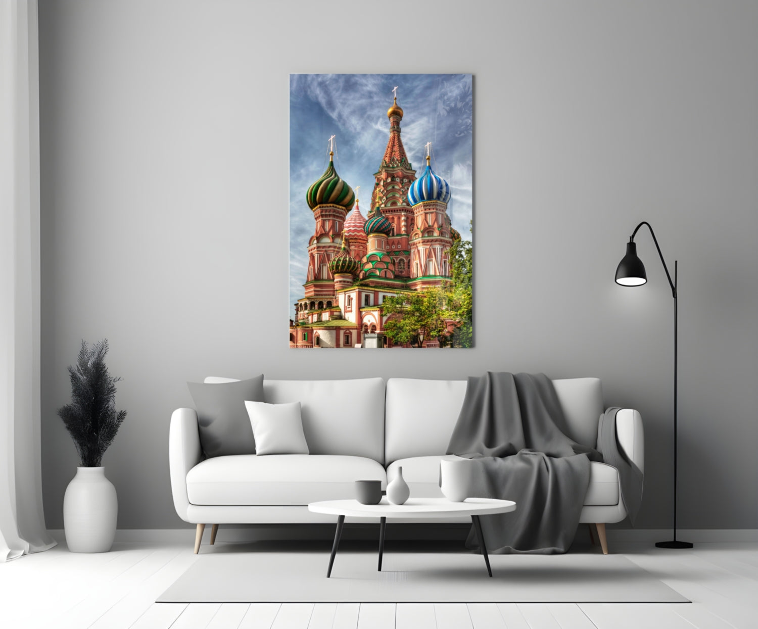Saint Basil's Cathedral glass wall art displayed above a white sofa in a minimalist living room setting.