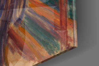 Close-up angled view of glass wall art with layered diagonal stripes in orange, red, green, and brown tones against gray background.