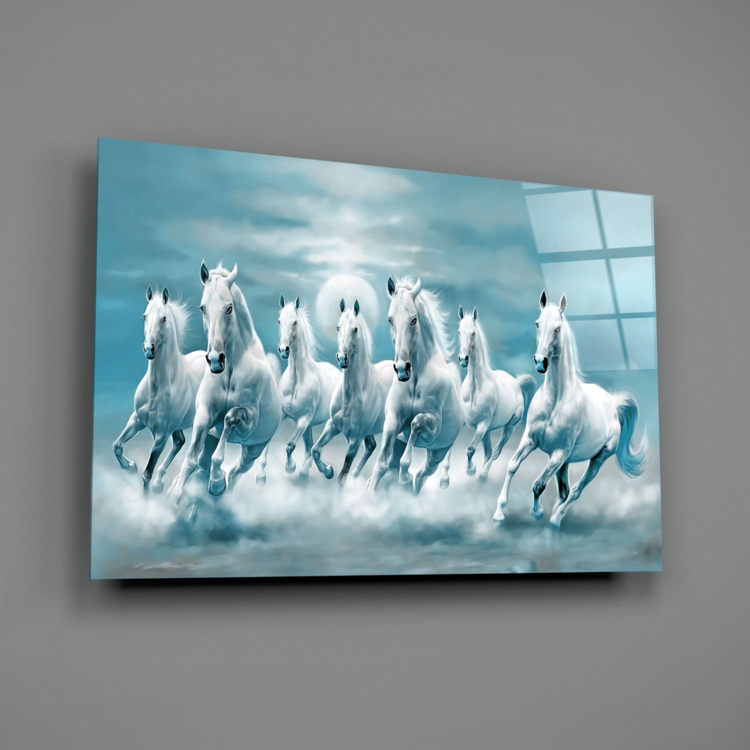Seven white horses galloping through clouds against a blue sky, displayed on glass wall art mounted on gray wall.
