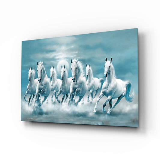 Seven white horses galloping through mist beneath a blue cloudy sky, displayed on angled glass wall art.