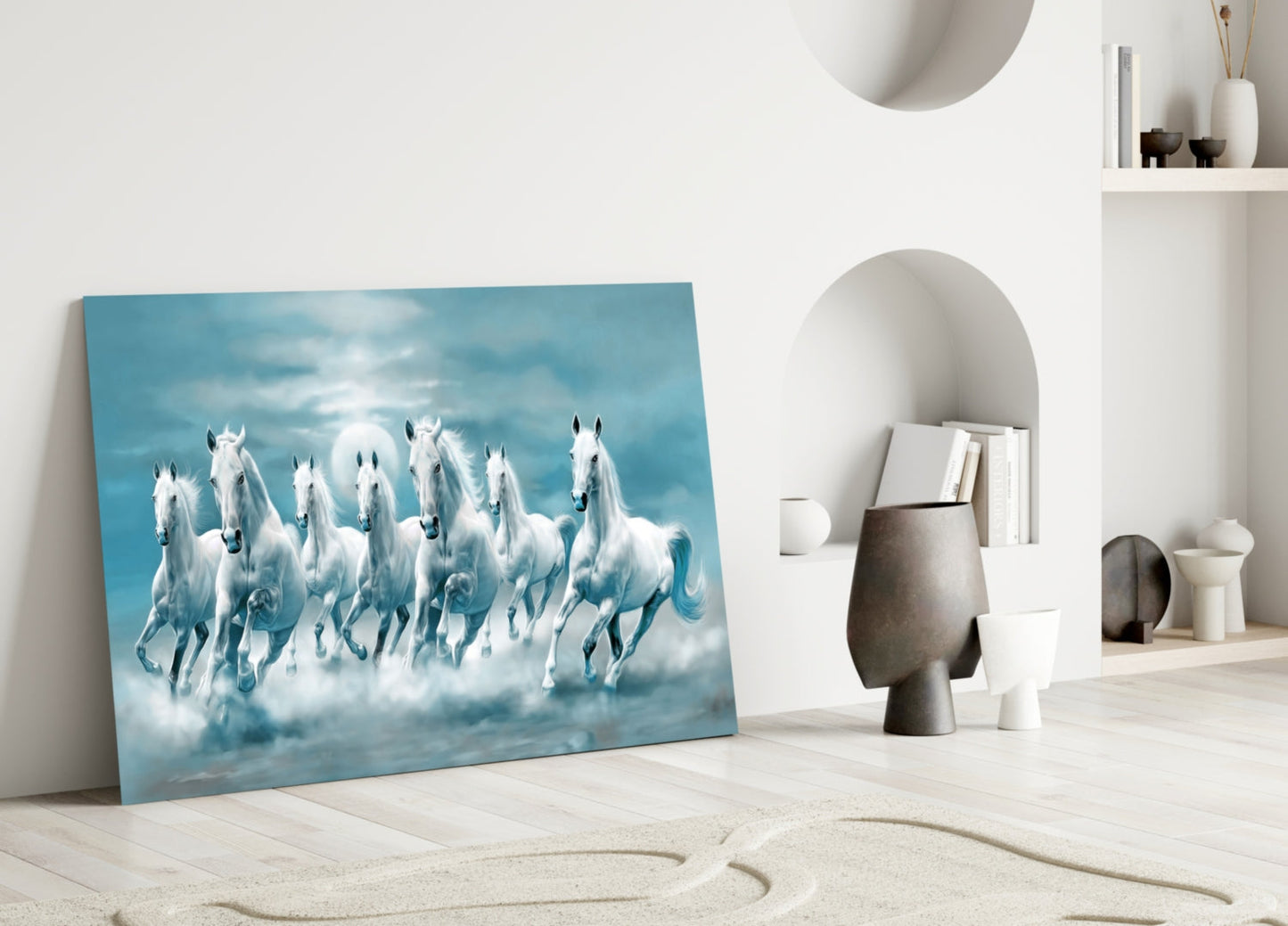 White Horses Glass Wall Art leaning against white wall in minimalist room with sand, decorative objects, and alcove shelving.