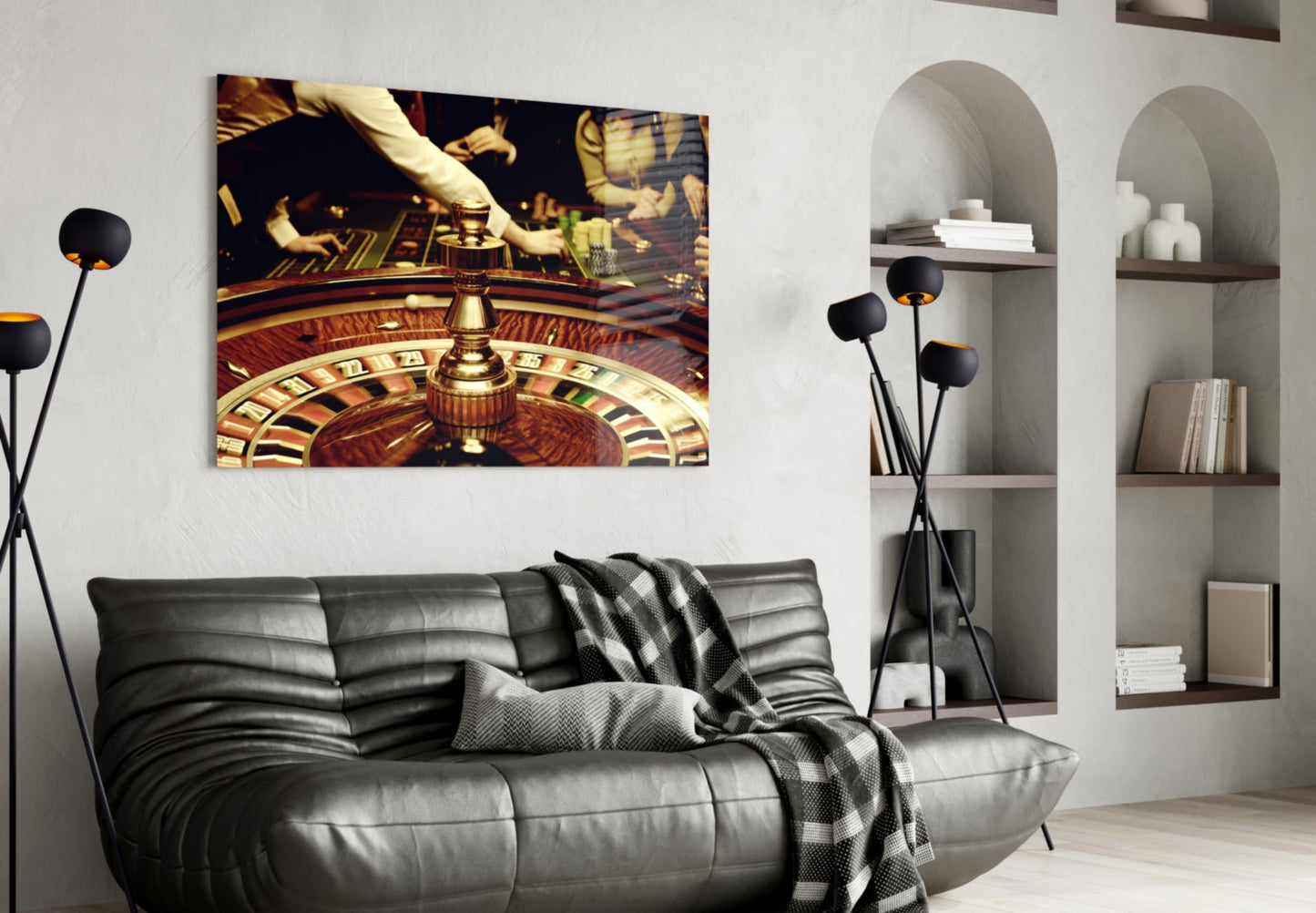 Roulette wheel glass art displayed above black leather sofa in modern living room with arched shelving.