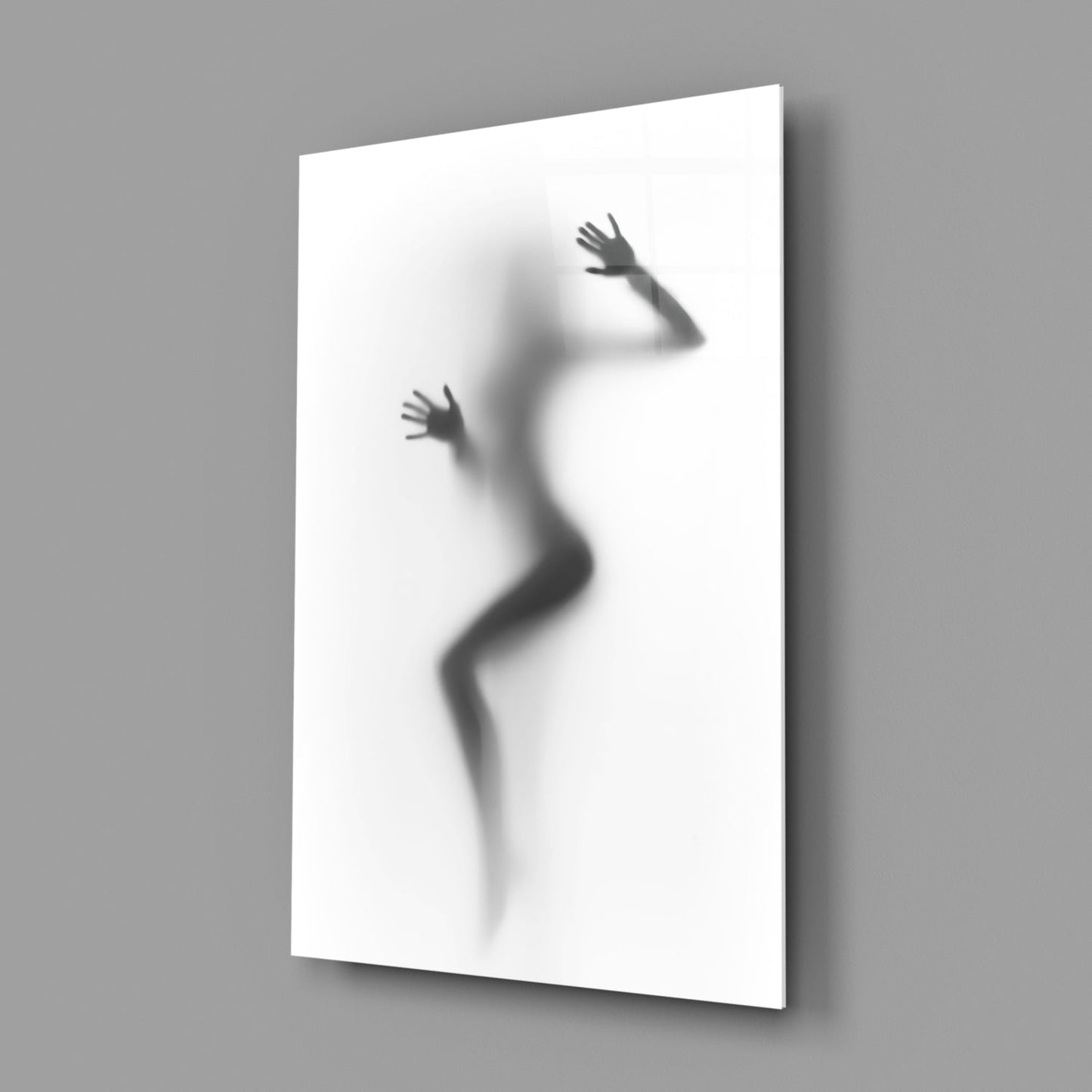 Frosted glass panel displaying silhouette of woman's body in dynamic pose against white background, mounted at angle.