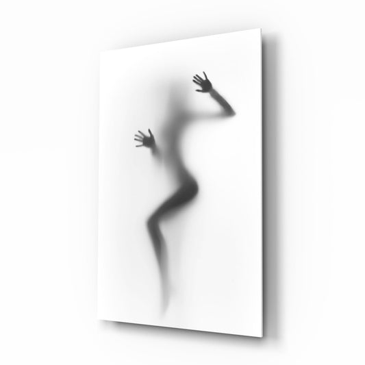 Silhouette of a contorted female figure pressed against translucent frosted glass, shown at three-quarter angle against white background.