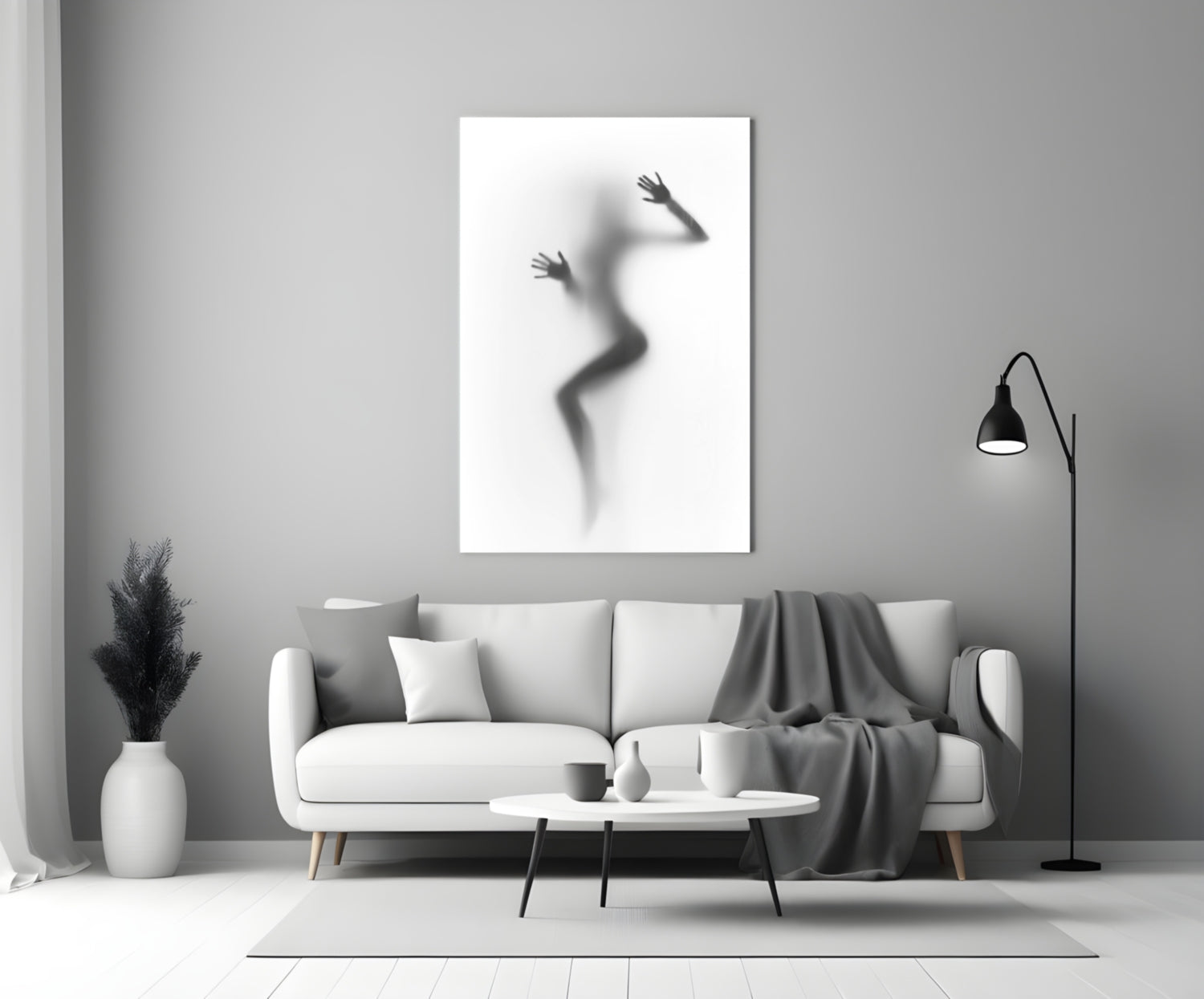 Woman Shadow Glass Wall Art displayed above a white sofa in a minimalist living room setting.