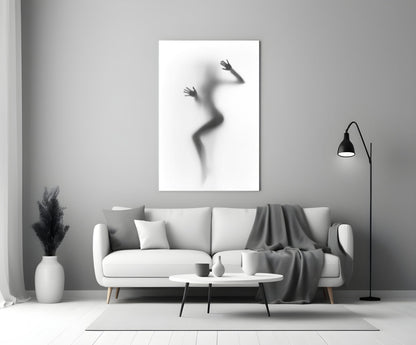 Woman Shadow Glass Wall Art displayed above a white sofa in a minimalist living room setting.