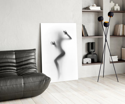 Modern living room interior featuring frosted glass wall art with silhouette of woman's figure displayed against white wall.