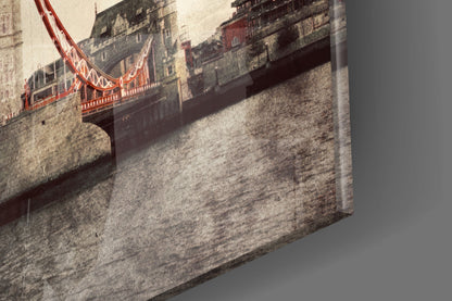 Tower Bridge glass wall art displayed at an angle, showing the red bridge structure and stone buildings against a cream background.