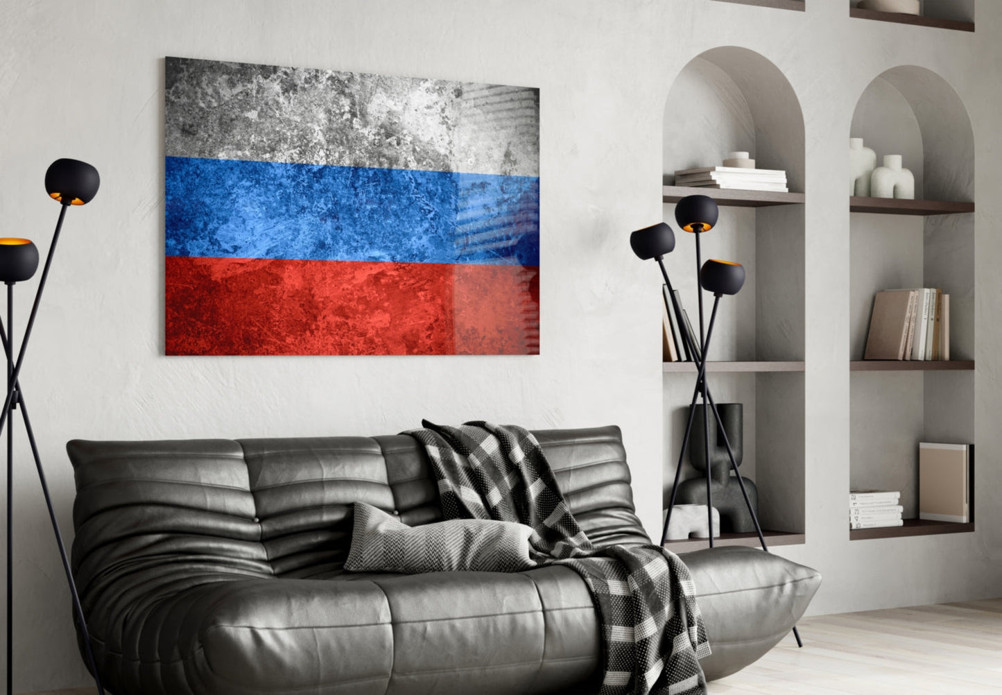 Russian flag glass wall art with white, blue, and red horizontal stripes displayed above black leather sofa in modern living room.