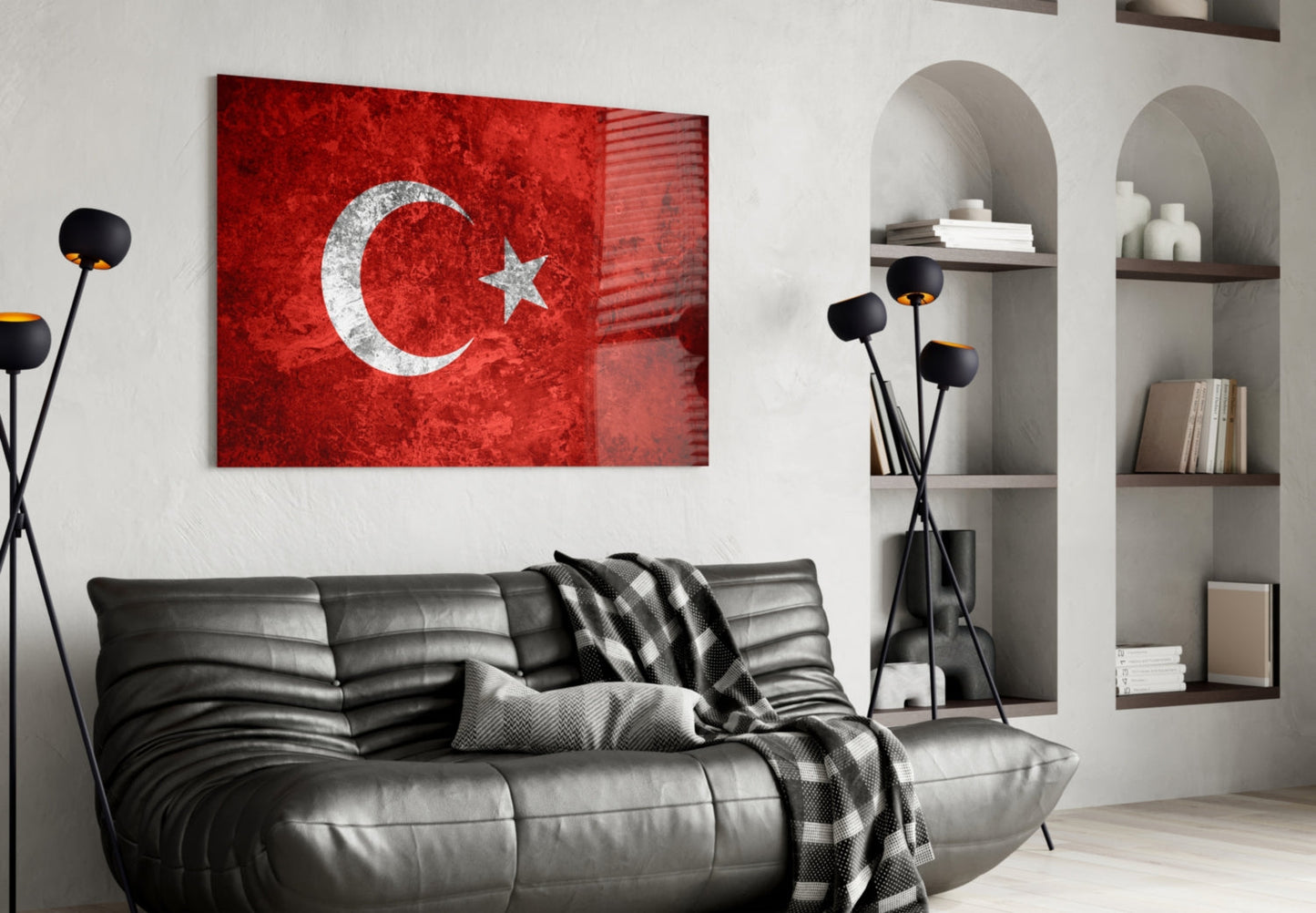 Turkish flag glass wall art with red background and white crescent-star displayed above black leather sofa in modern living room interior.