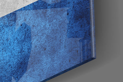Close-up angled view of blue textured glass panel with visible edge and shadow detail.