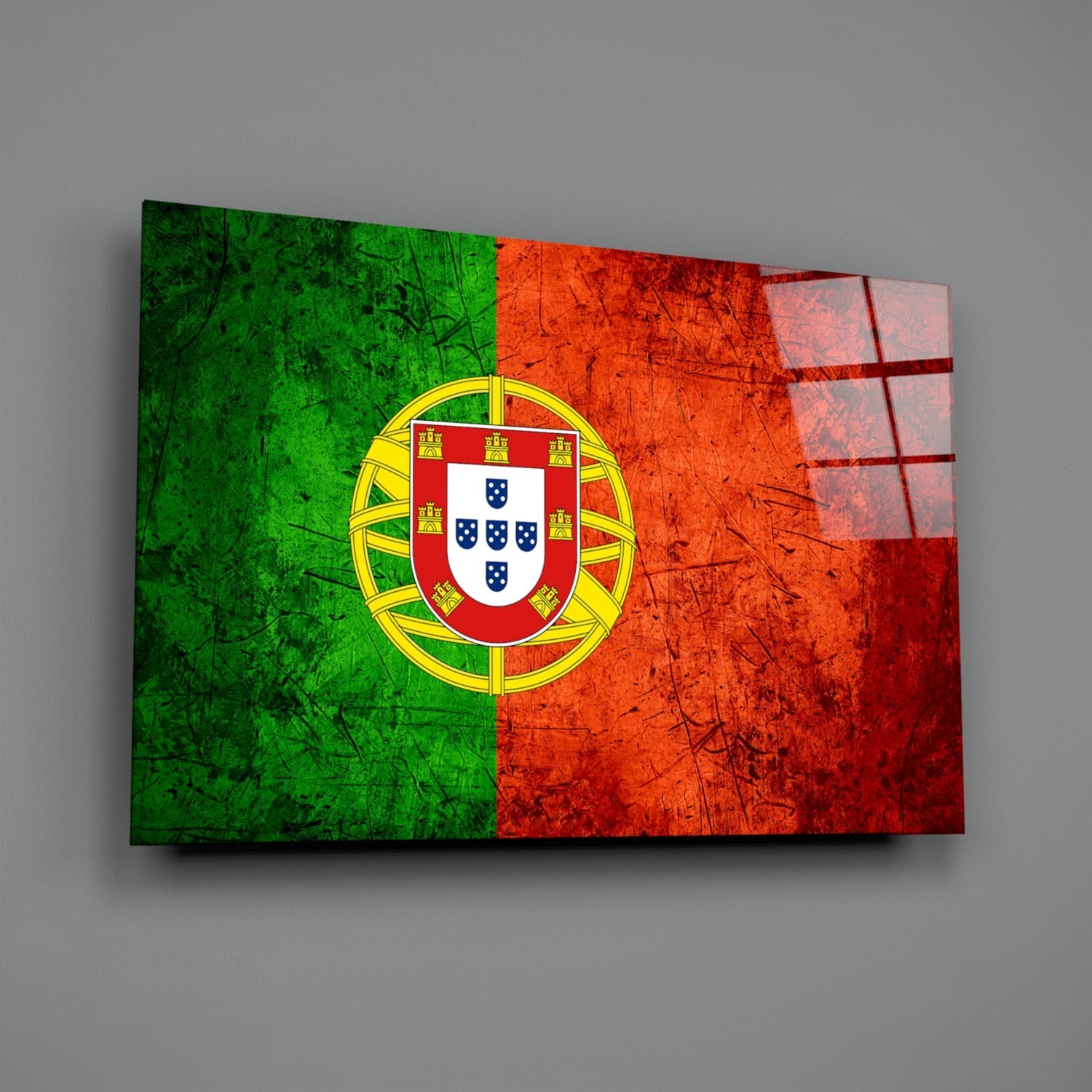 Portuguese flag glass wall art displayed at an angle showing green, red, and yellow colors with central coat of arms emblem.