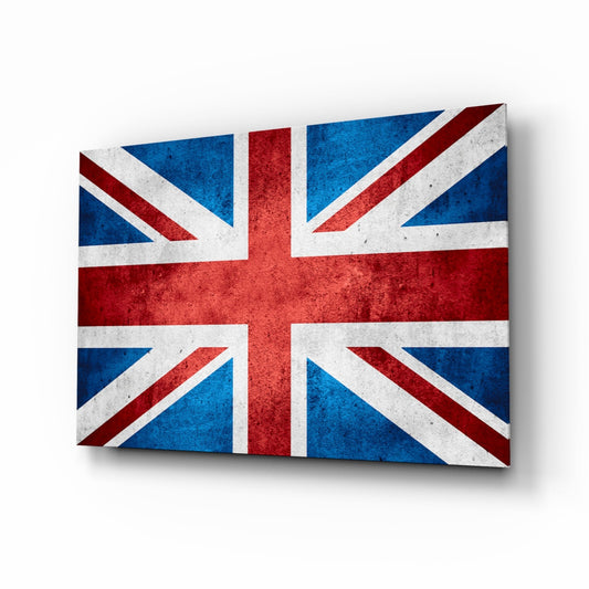 Angled perspective view of a rectangular glass wall art panel displaying a distressed Union Jack flag in blue, red, and white with weathered texture and shadow effect.