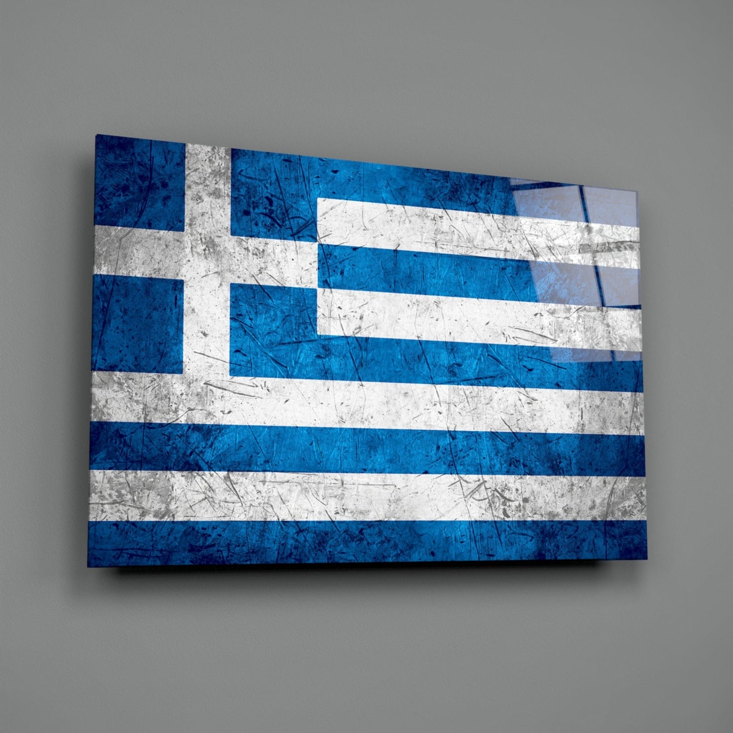 Greek flag glass wall art displayed at an angle, showing blue and white horizontal stripes with a distressed texture.