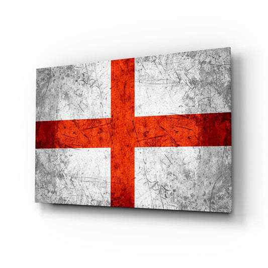 Angled perspective view of a rectangular glass wall art panel displaying the England flag with red cross on white and gray scratched steel texture background.