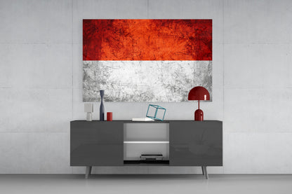 Indonesian flag glass wall art with red and white horizontal stripes displayed above gray media console in modern interior setting.
