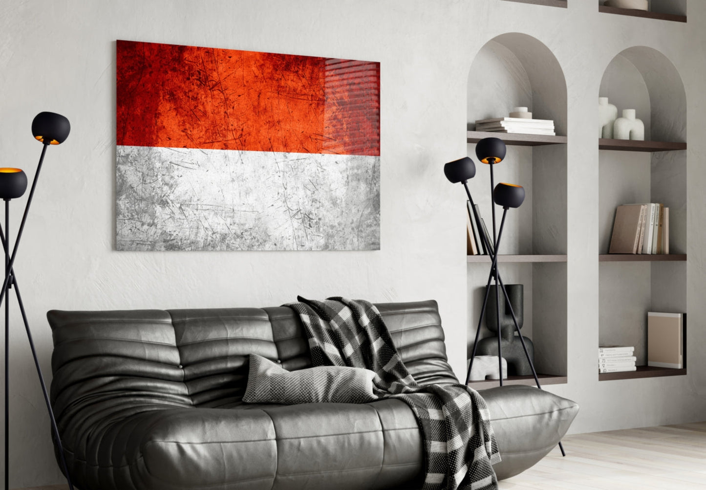 Indonesian flag glass wall art displaying red and white horizontal stripes hanging above black leather sofa in modern living room.