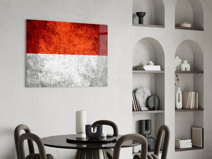 Indonesian flag glass wall art with red and white horizontal stripes displayed above a dining table in a modern interior.