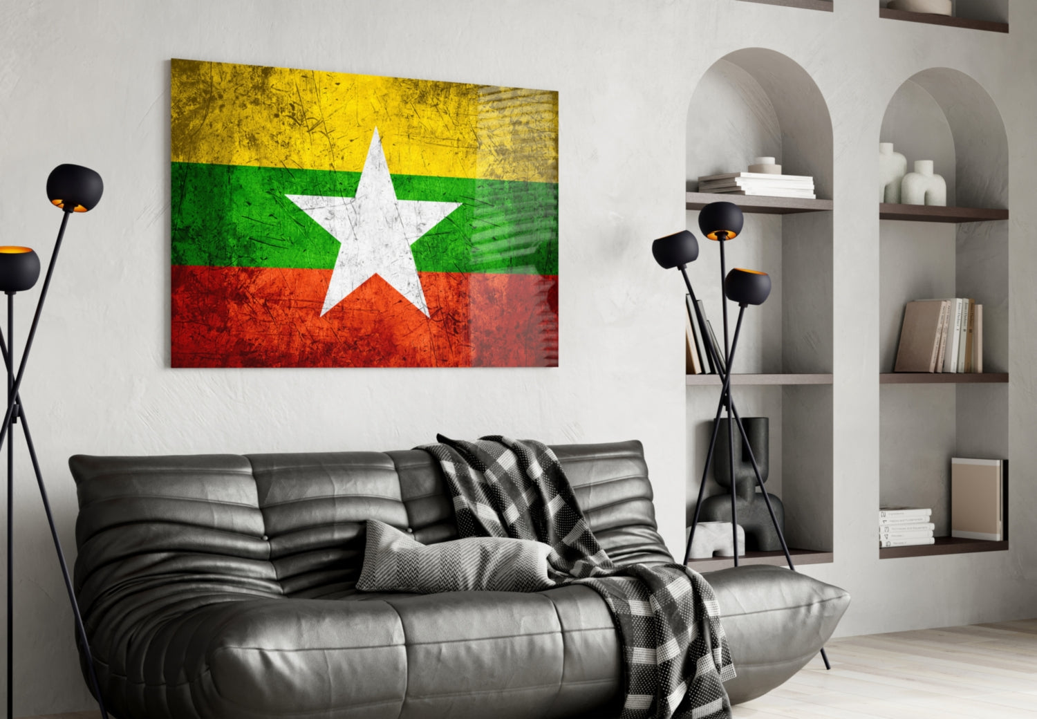 Myanmar flag glass wall art displaying yellow, green, white, and red horizontal stripes with white star, hung above black leather sofa in modern living room.