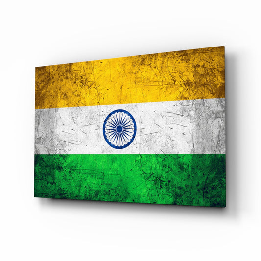 Indian flag glass wall art displayed at an angle, showing weathered yellow, white, and green horizontal stripes with blue Ashoka Chakra emblem.
