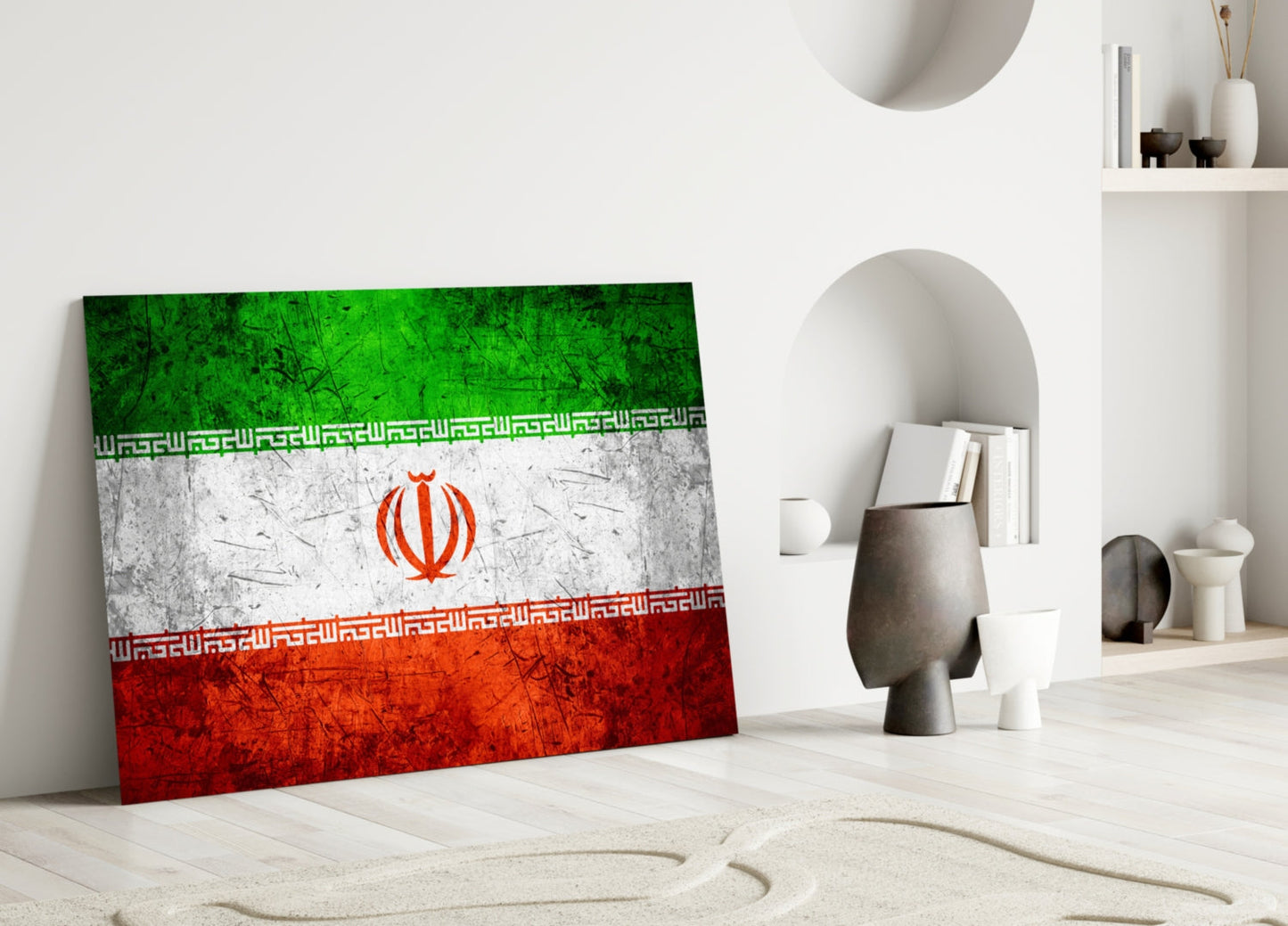 Iranian flag glass art leaning against white wall in minimalist room with shelving and decorative objects.