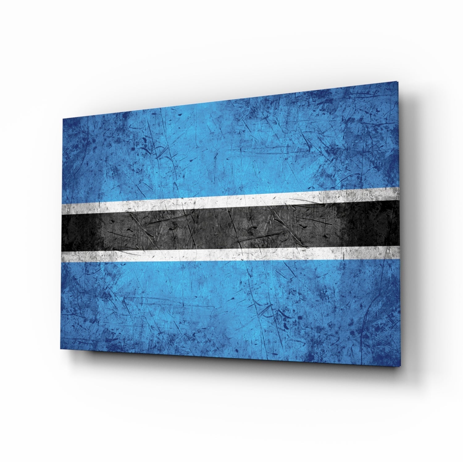 Botswana flag glass wall art displayed at an angle, showing blue, white, and black horizontal stripes with a weathered texture and shadow effect.