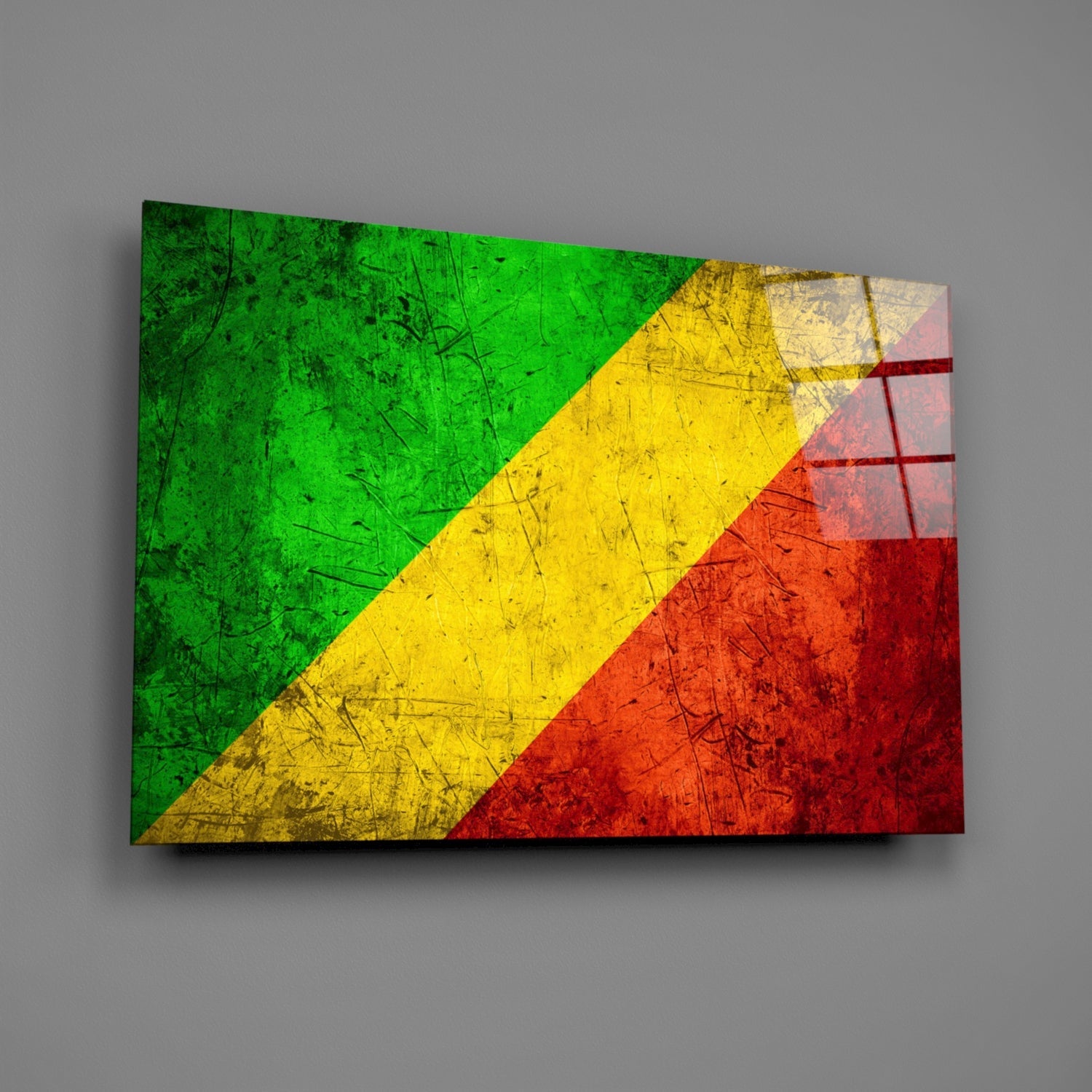 Angled view of a glass wall art displaying the Republic of the Congo flag with green, yellow, and red diagonal stripes and distressed texture.