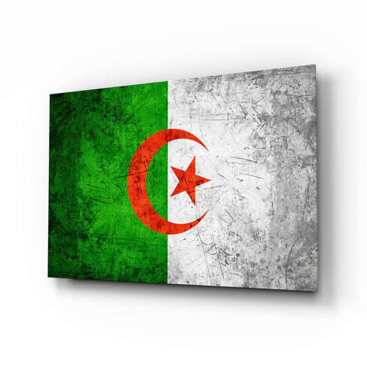 Angled perspective view of Algerian flag glass wall art displaying green and white sections with red crescent moon and star, showing textured surface and shadow.