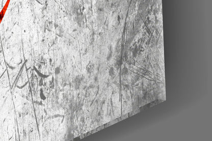 Close-up of textured glass surface with etched designs and red stripe detail in corner.