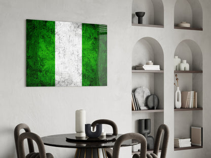 Nigerian flag glass wall art with green, white, and green vertical stripes displayed above dining table in modern interior.