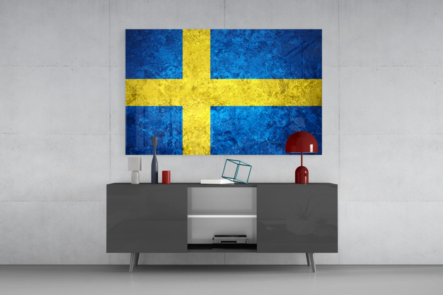 Swedish flag glass wall art in blue and yellow displayed above a gray media console with decorative items in a modern interior setting.