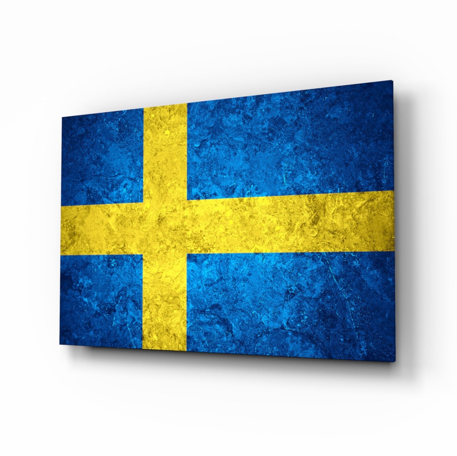 Swedish flag glass wall art displayed at an angle, showing blue and yellow textured surface with shadow.