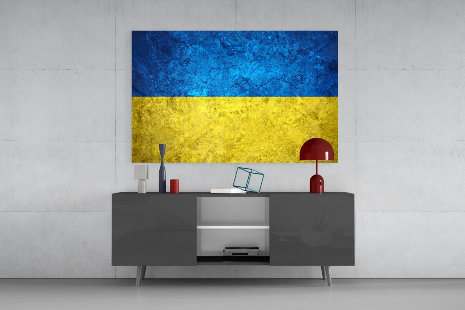 Ukrainian flag glass wall art displayed above gray media console with decorative items in modern interior setting.
