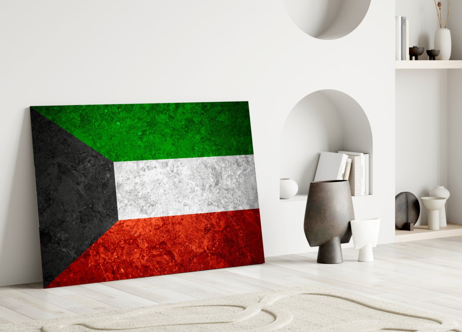 Kuwaiti flag glass wall art leaning against white wall in minimalist room setting with decorative objects.