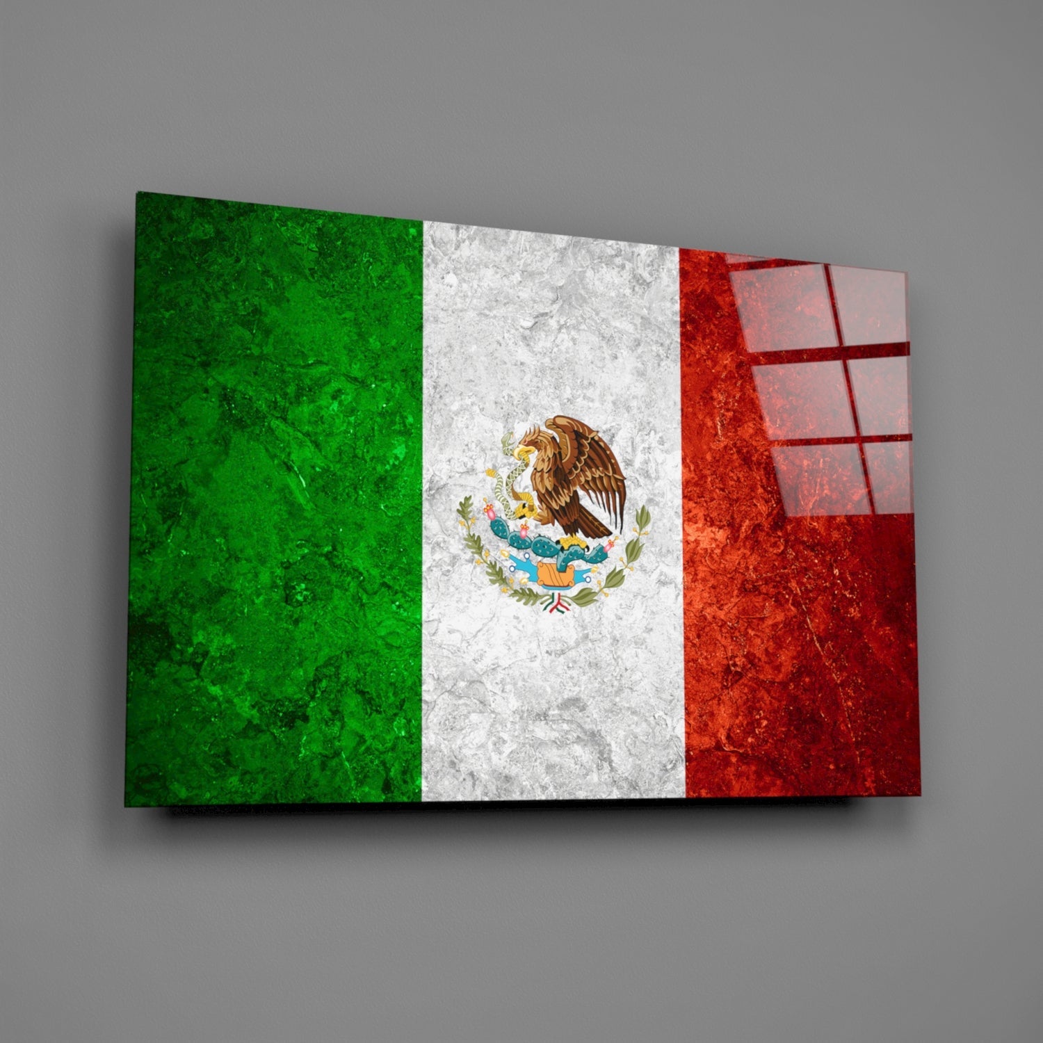 Mexican flag glass wall art panel displayed at an angle, showing green, white, and red vertical stripes with central eagle emblem.