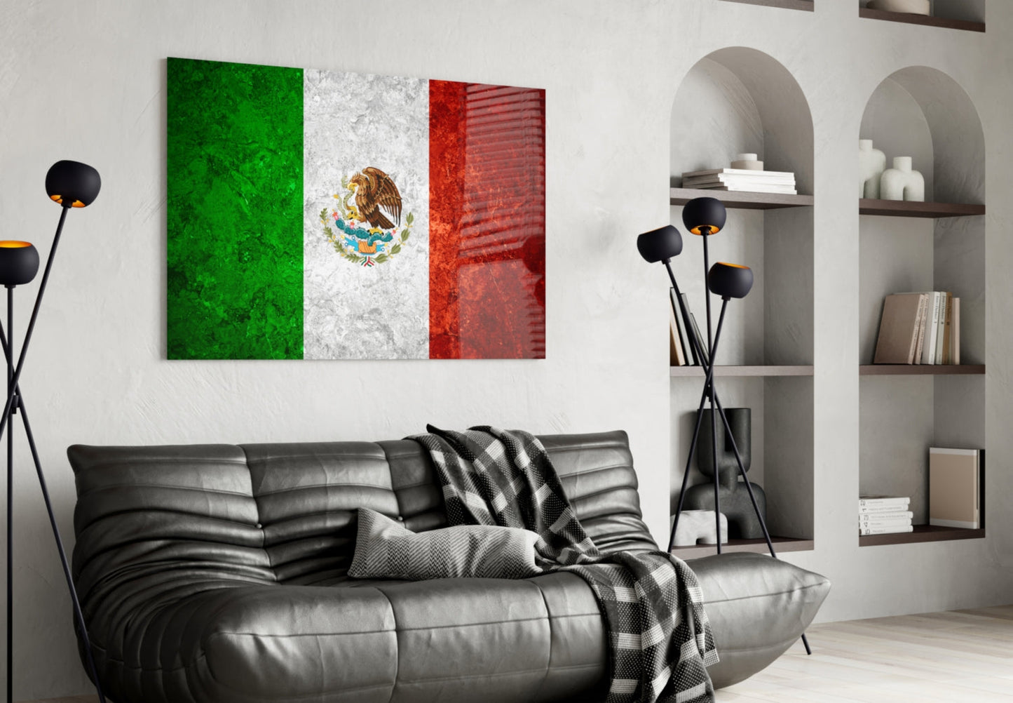Mexican flag glass wall art with green, white, and red vertical stripes and eagle emblem displayed above black leather sofa in modern living room.