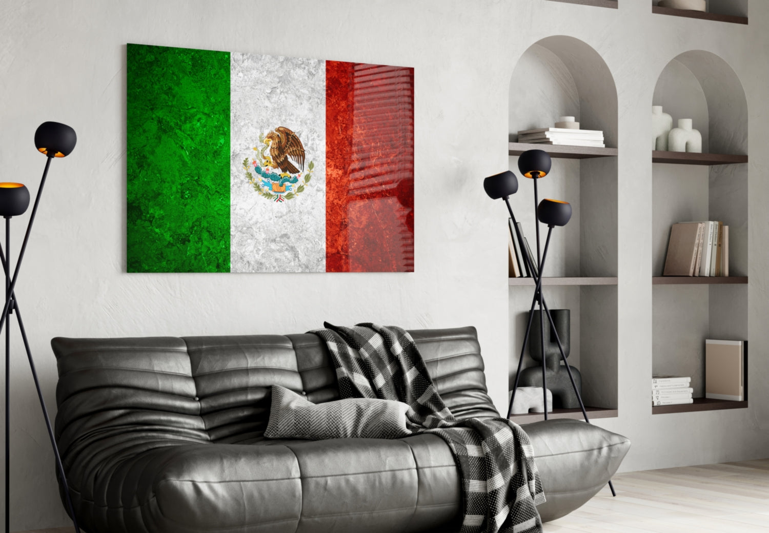 Mexican flag glass wall art with green, white, and red vertical stripes and eagle emblem displayed above black leather sofa in modern living room.