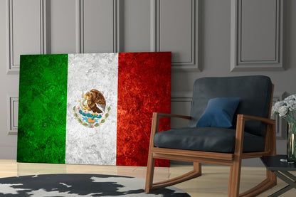 Mexican flag glass wall art displayed behind a wooden rocking chair in a modern interior setting.