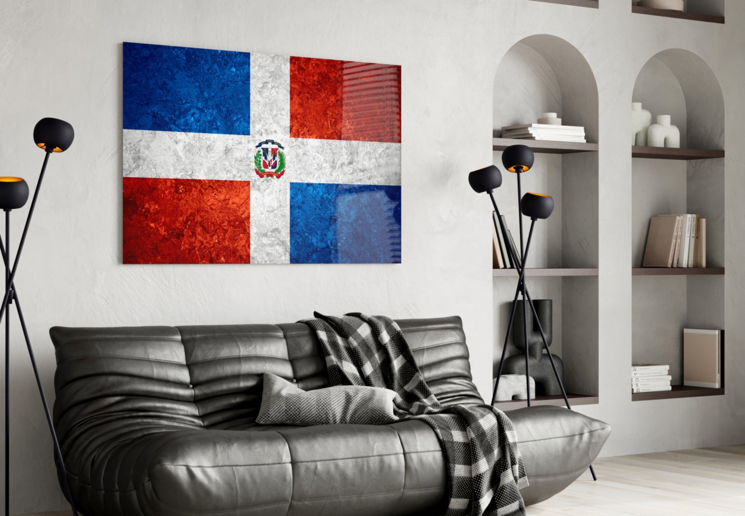 Dominican Republic flag glass wall art displayed above black leather sofa in modern living room with built-in shelving.