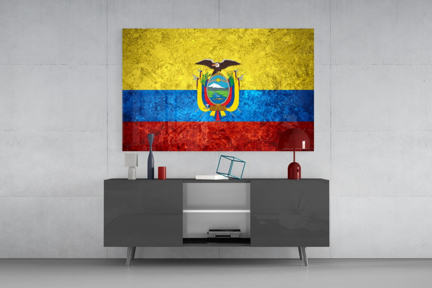 Glass wall art displaying Ecuador's flag with yellow, blue, and red horizontal stripes and central coat of arms, mounted above gray media console.