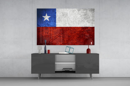 Chilean flag glass wall art with blue, white, and red horizontal sections and white star displayed above gray media console in modern interior.