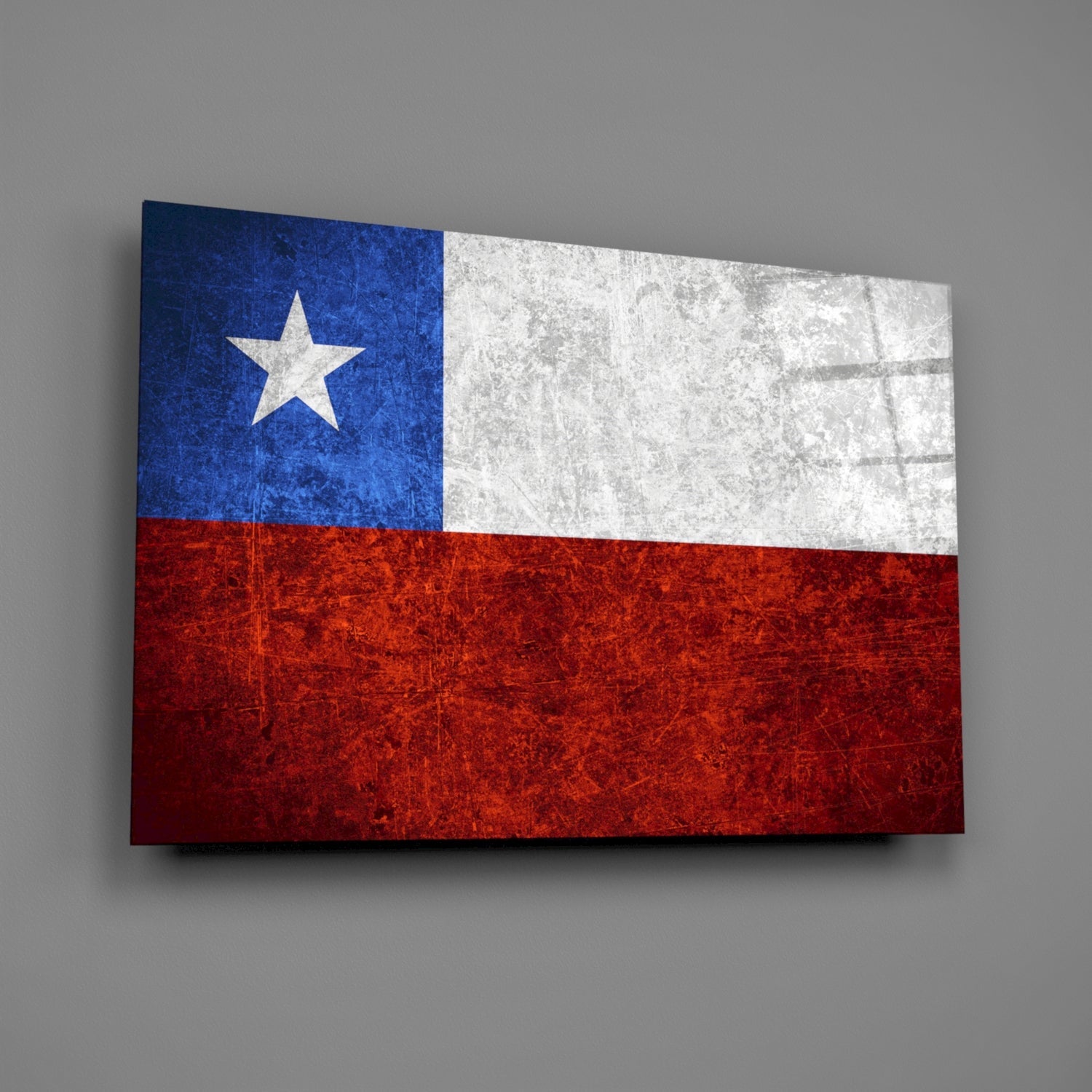 Chilean flag glass wall art displayed at an angle showing blue, white, and red sections with white star on gray background.