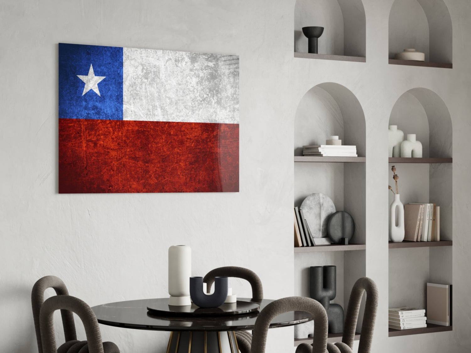 Chilean flag glass wall art displaying blue, white, and red sections with white star, hung above black dining table in modern interior.