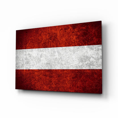 Austrian flag glass wall art displayed at an angled perspective, showing red-white-red horizontal stripes with distressed texture.